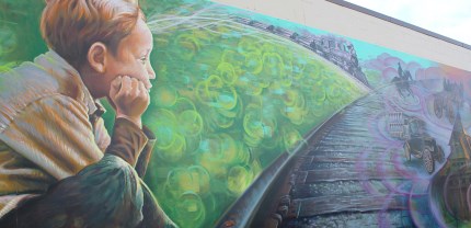 Boy views railroad track